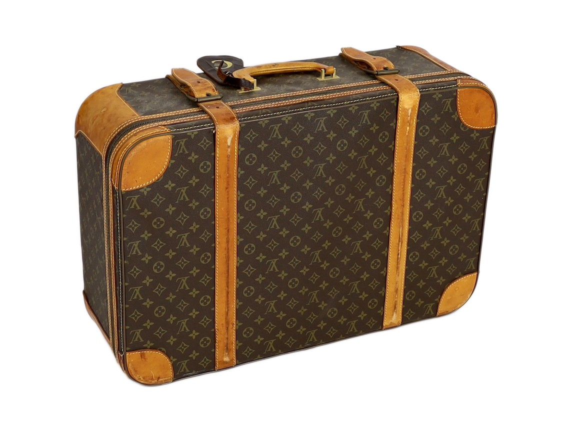 A 1980/90s Louis Vuitton canvas monogram suitcase, 59cm wide, 46cm deep, 23cm high